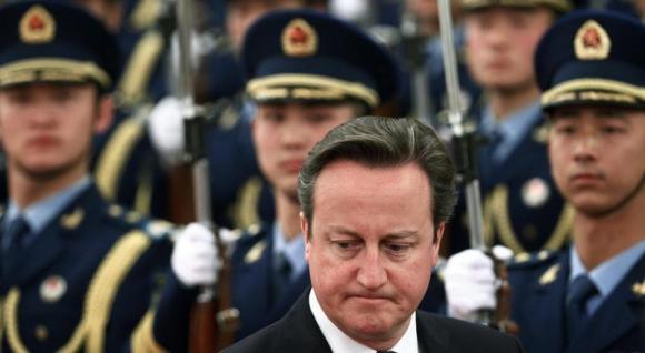 British PM Cameron inspects the guard of honour during an official welcoming ceremony in Beijing