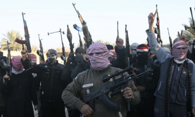 Masked Sunni gunmen chant slogans during a protest against Iraq's Shiite-led government, demanding that the Iraqi army not try to enter the city, in Falluja