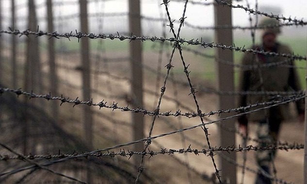File photo of an Indian BSF soldier patrolling near the fenced border with Pakistan in Suchetgarh