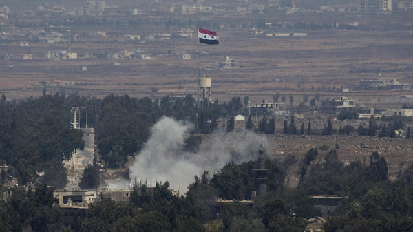 Smoke rises following an explosion on the Syrian side near the Quneitra border crossing