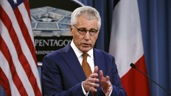 U.S. Secretary of Defense Hagel speaks during a joint news conference with French Minister of Defense Le Drian following their meeting at the Pentagon in Washington