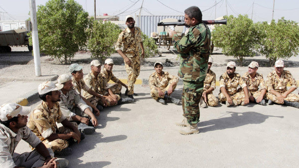 Shi'ite volunteers take part in a field training in Basra